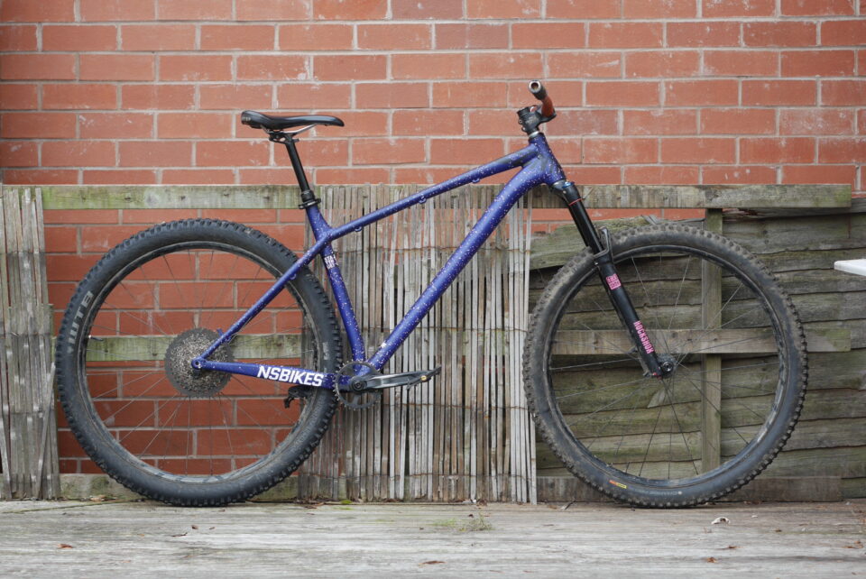 Used MTB frame with full-suspension linkage and slack head angle