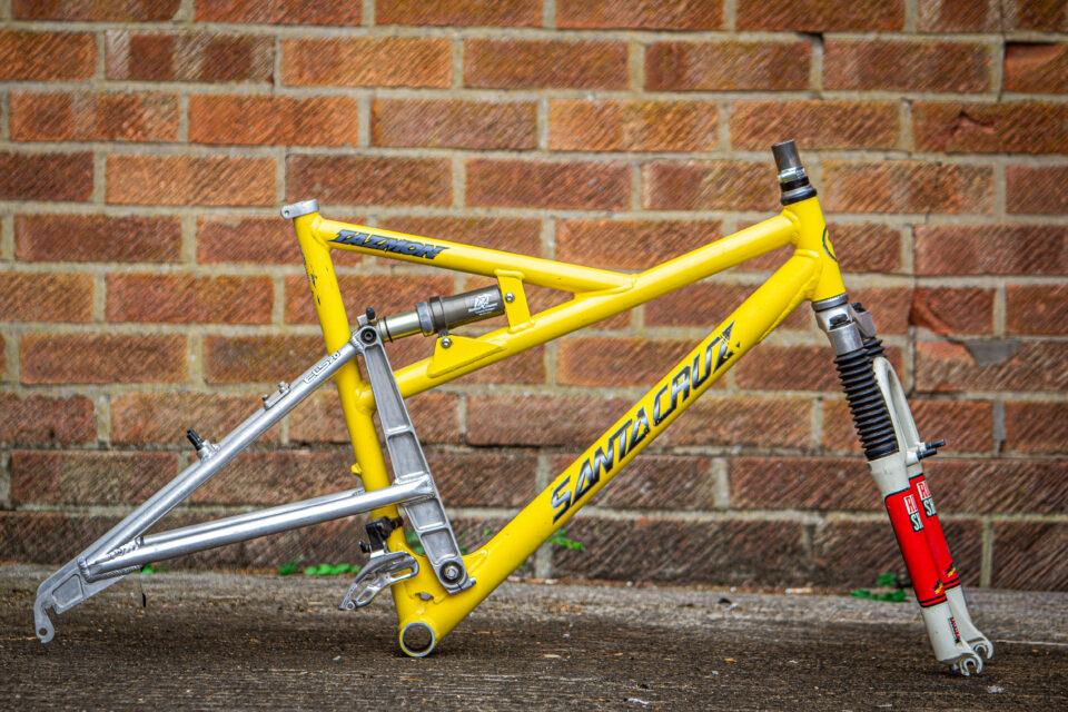 Used MTB frame with full-suspension linkage and slack head angle