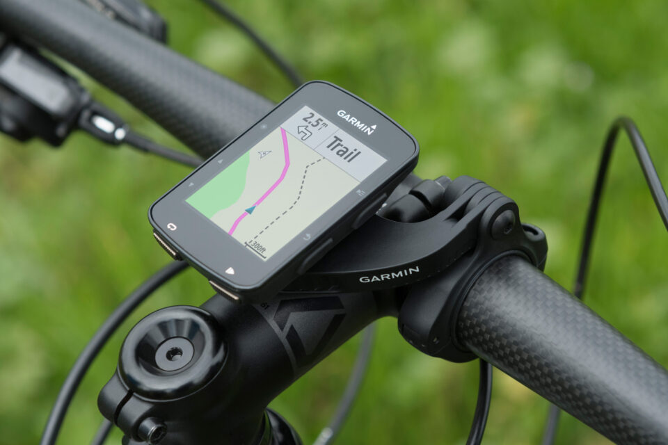 Used cycling GPS head unit and phone mount setup on bike handlebars