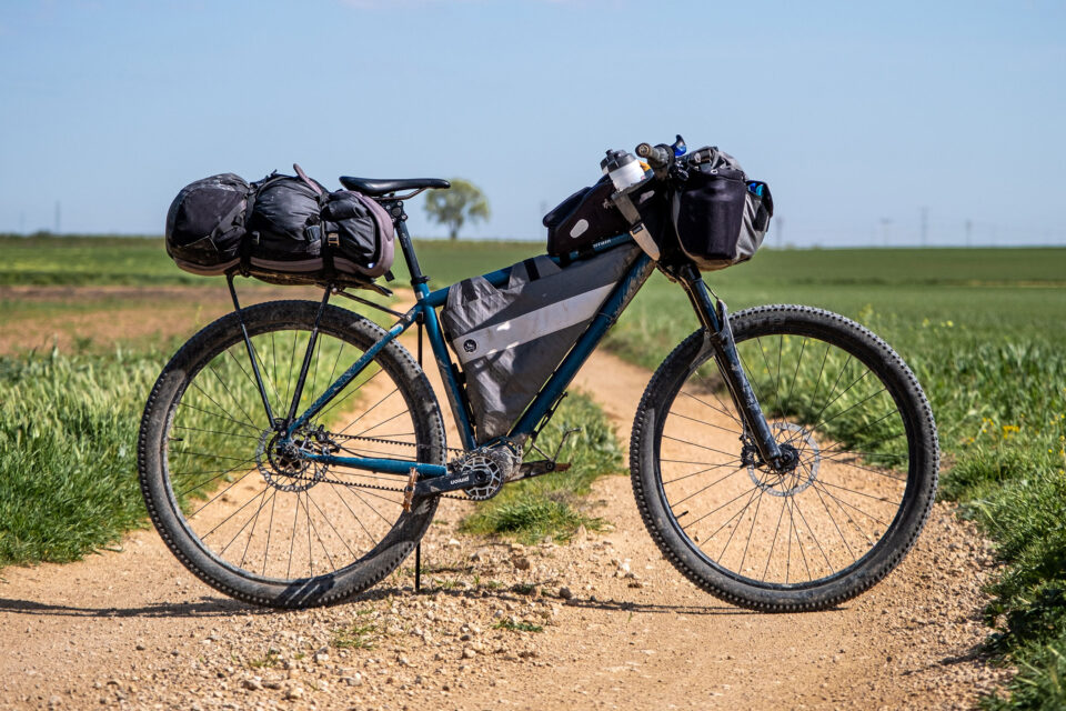 Second-hand bikepacking bags and gear mounted on bicycle